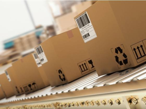 Packed cartons moving along a warehouse conveyor line